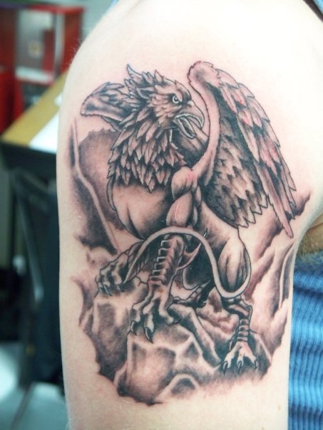 Black Ink Griffin Tattoo On Right Shoulder