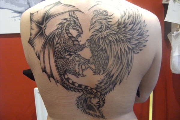 Black Ink Griffin With Dragon Tattoo On Back