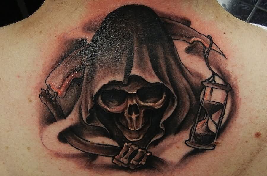 Black Ink Grim Reaper Head Tattoo On Man Upper Back