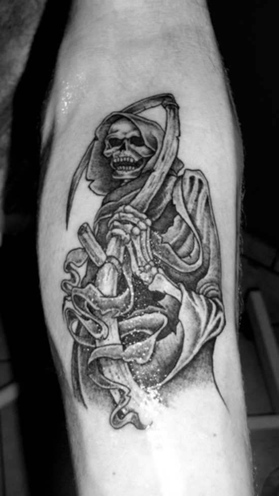 Black Ink Grim Reaper Tattoo On Left Forearm