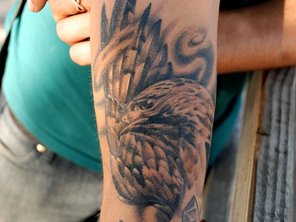 Black Ink Hawk Tattoo On Left Half Sleeve
