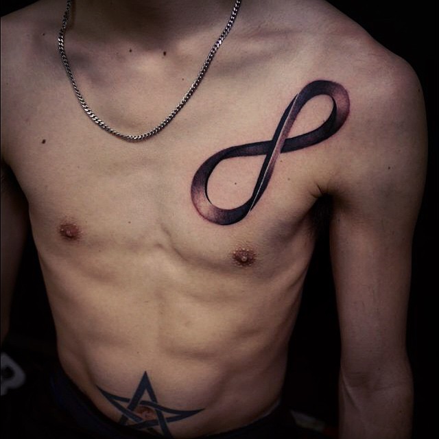 Black Ink Infinity Tattoo On Man Left Front Shoulder