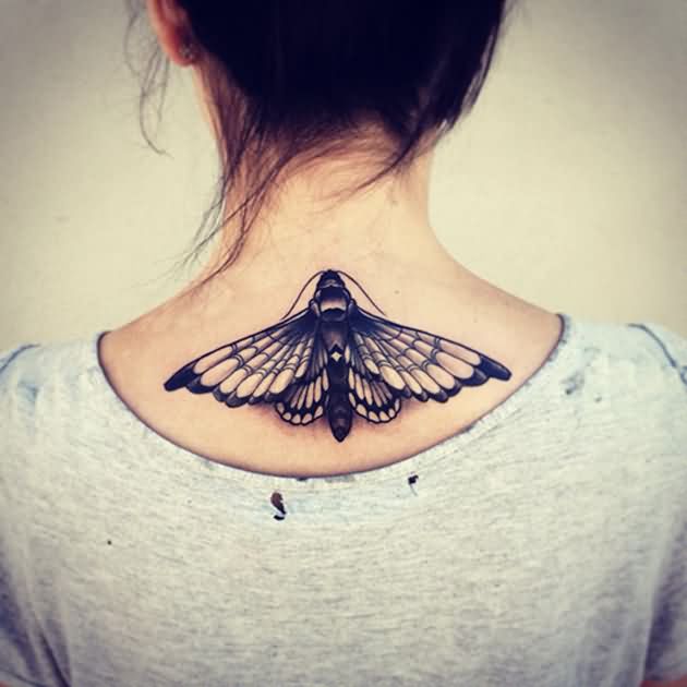 Black Ink Insect Tattoo On Girl Upper Back