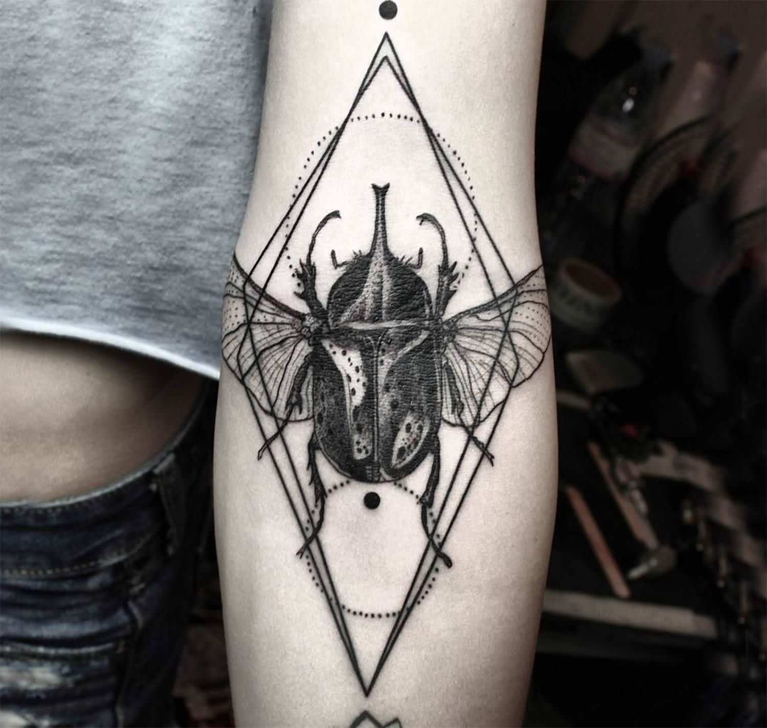 Black Ink Insect Tattoo On Left Forearm