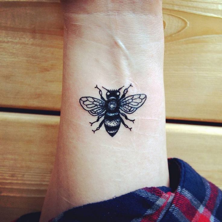 Black Ink Insect Tattoo On Wrist