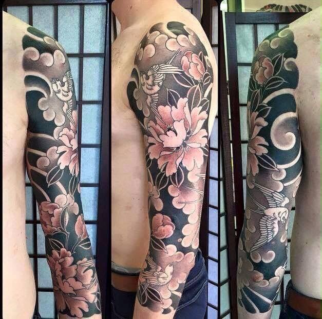 Black Ink Japanese Flowers Tattoo On Man Left Full Sleeve