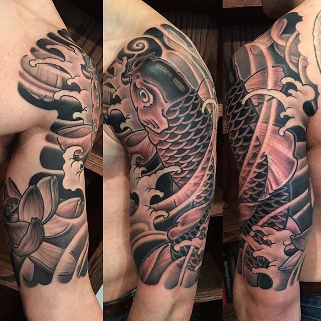 Black Ink Japanese Koi Fish Tattoo On Man Left Half Sleeve