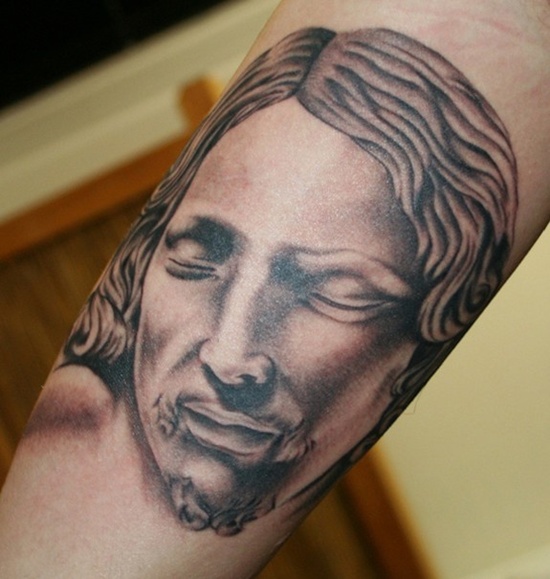 Black Ink Jesus Head Tattoo On Right Bicep