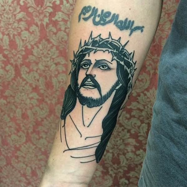Black Ink Jesus Head Tattoo On Right Forearm