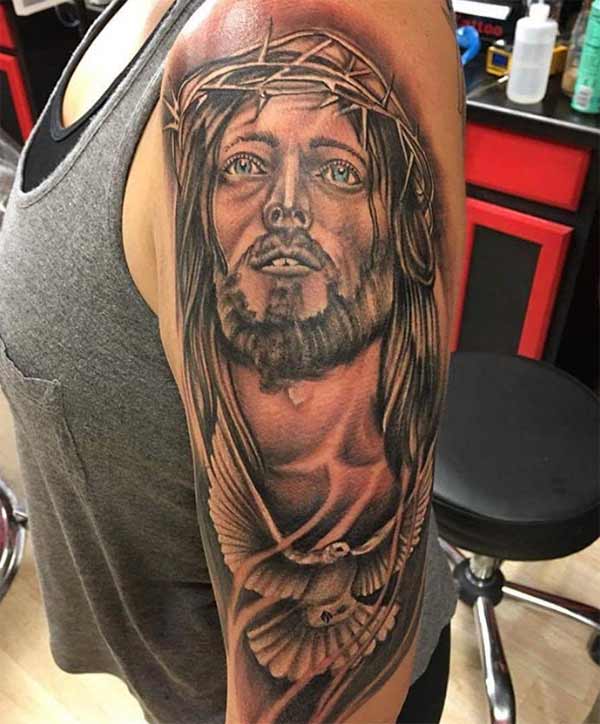 Black Ink Jesus Head With Bird Tattoo On Man Left Half Sleeve