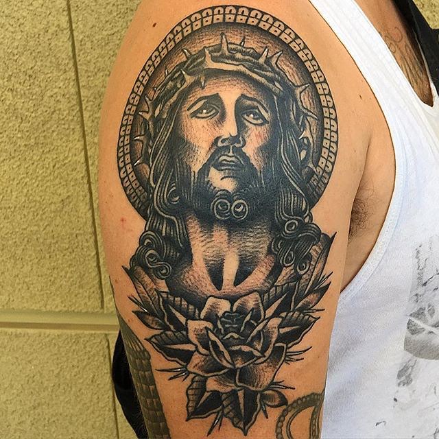 Black Ink Jesus Head With Rose Tattoo On Right Shoulder