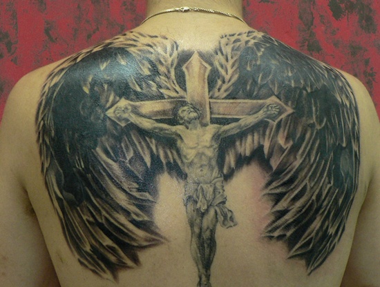 Black Ink Jesus On Cross With Wings Tattoo On Upper Back