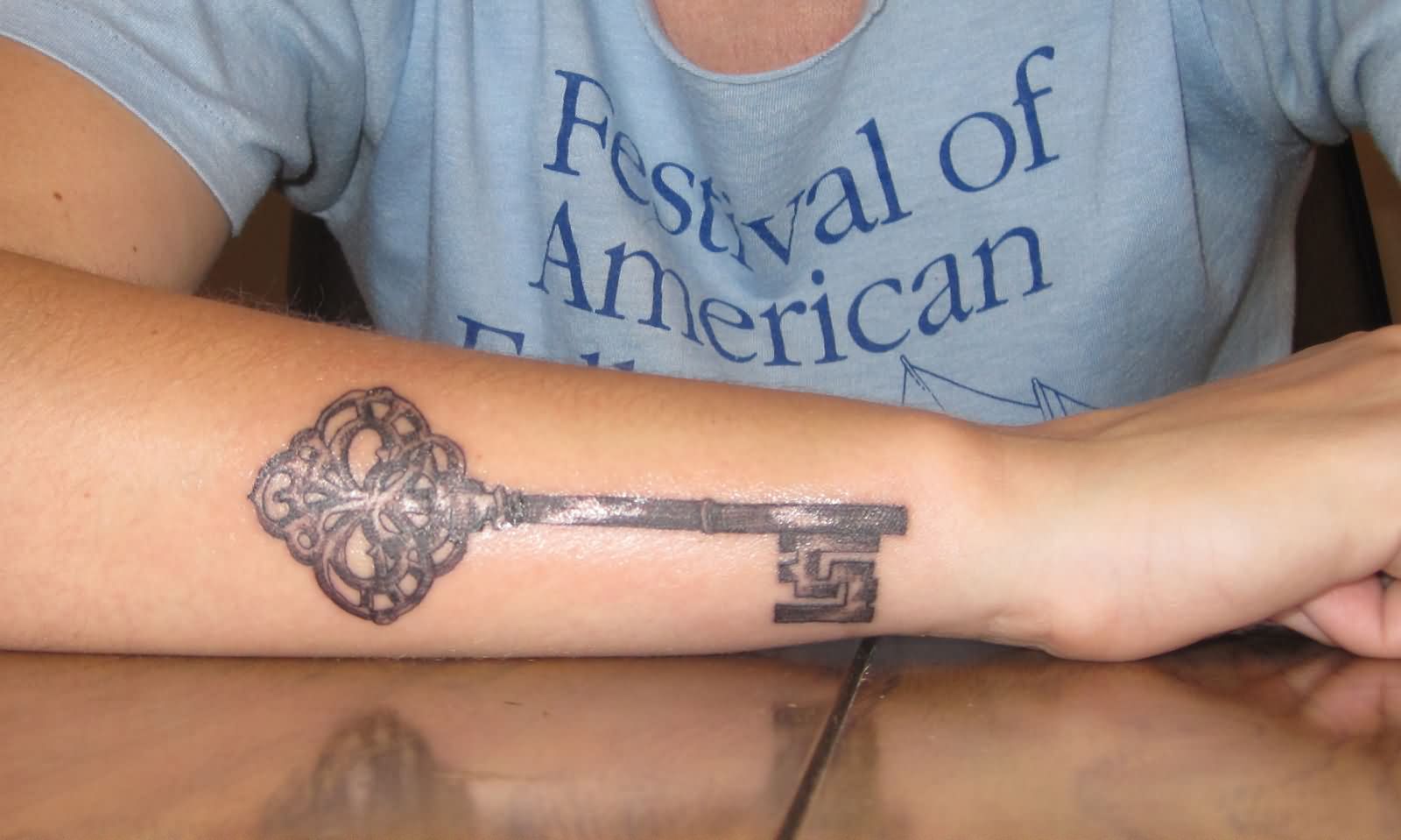 Black Ink Key Tattoo On Right Arm