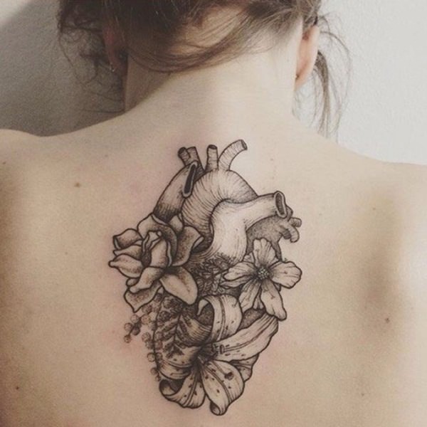 Black Ink Real Heart With Flowers Tattoo On Women Upper Back