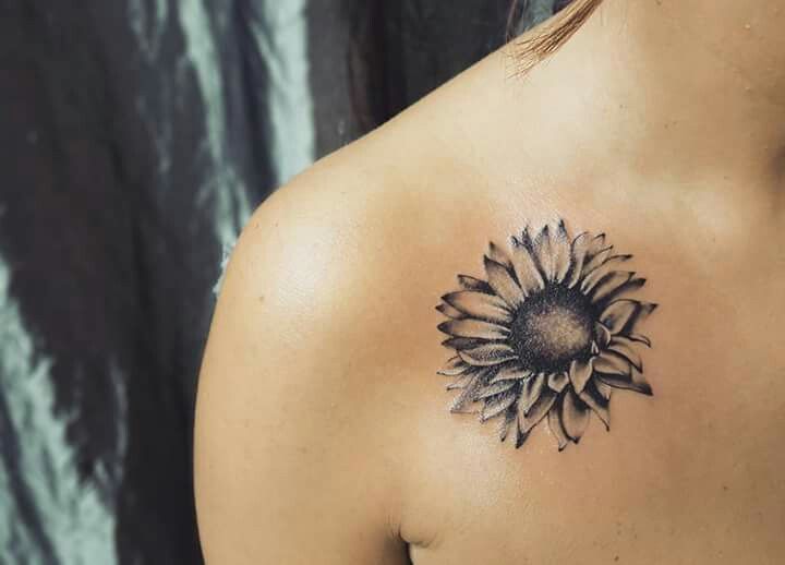Black Ink Sunflower Tattoo On Girl Right Front Shoulder