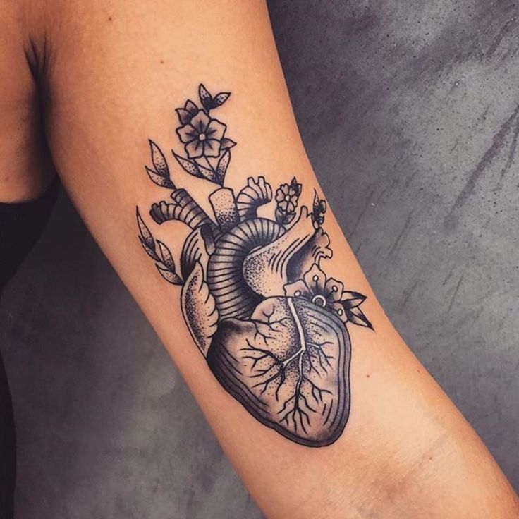 Black Ink Traditional Real Heart Tattoo On Left Bicep