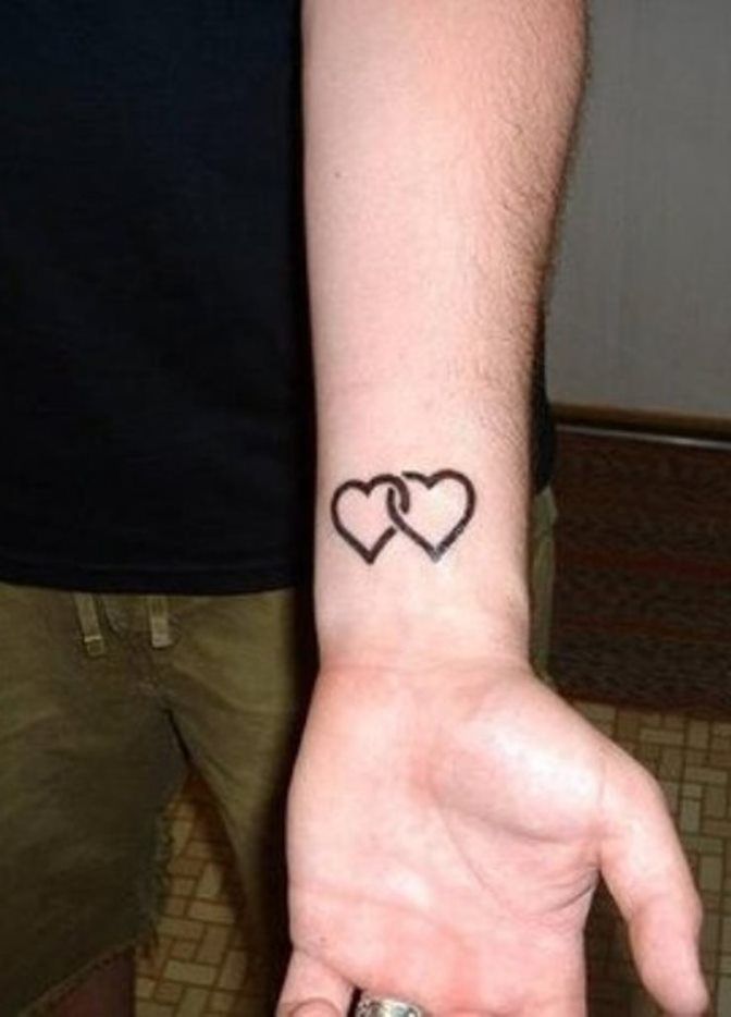 Black Ink Two Hearts Tattoo On Left Wrist