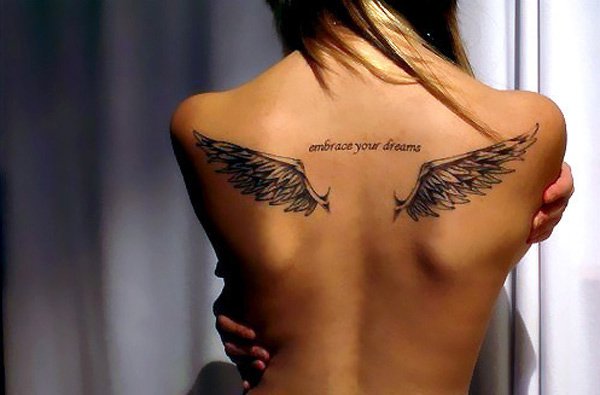 Black Ink Wings Tattoo On Girl Upper Back