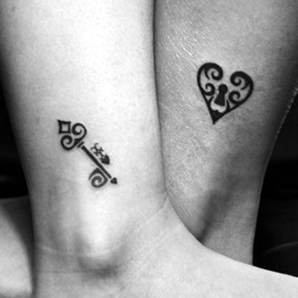 Black Tribal Heart Shape Lock And Key Tattoo Design For Leg
