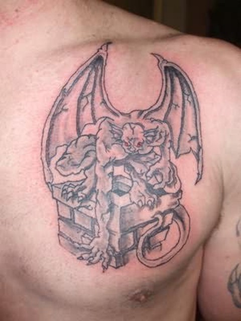 Classic Black Ink Gargoyle Tattoo On Man Left Chest