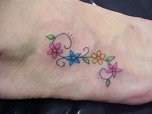Colorful Flowers Tattoo On Girl Right Foot