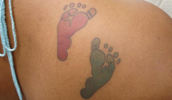 Colorful Footprints Tattoo On Right Back Shoulder