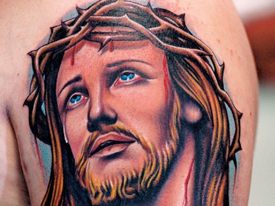Colorful Jesus Head Tattoo On Left Shoulder