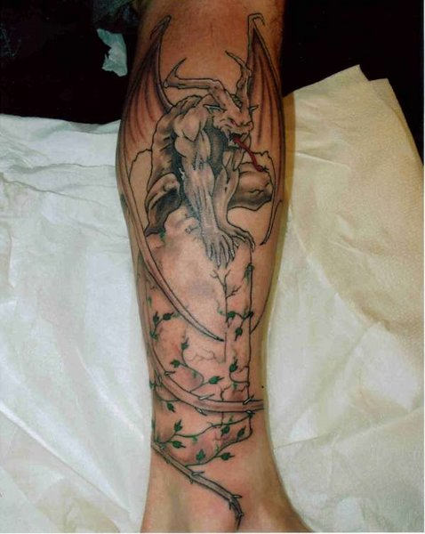 Cool Black Ink Gargoyle Tattoo On Leg Calf