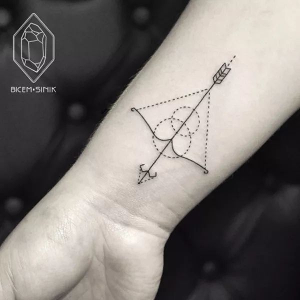 Geometric Arrow With Bow Tattoo On Right Wrist
