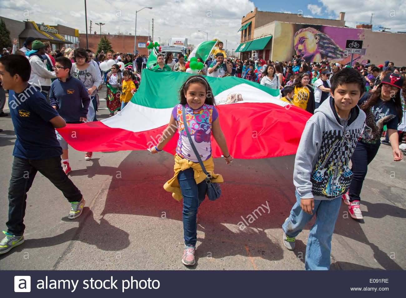 Kids With Mexican Flag During Cinco De Mayo Parade
