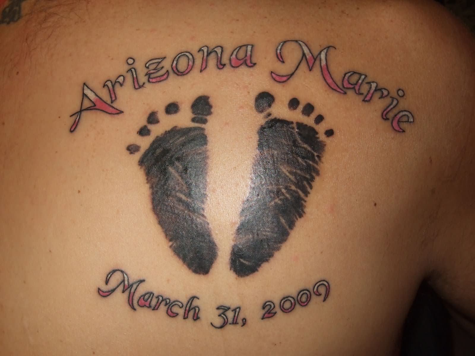 Memorial Black Ink Footprint Tattoo On Right Back Shoulder