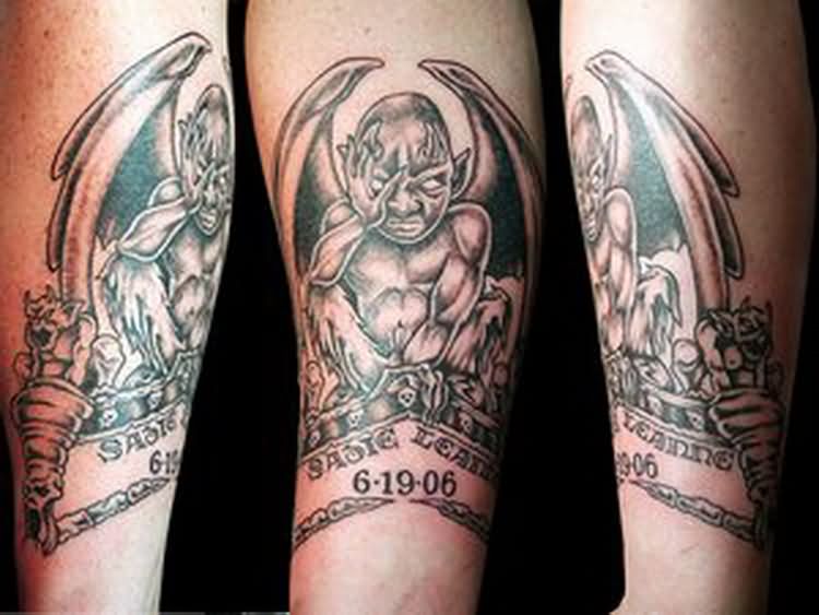 Memorial Black Ink Gargoyle Tattoo On Forearm