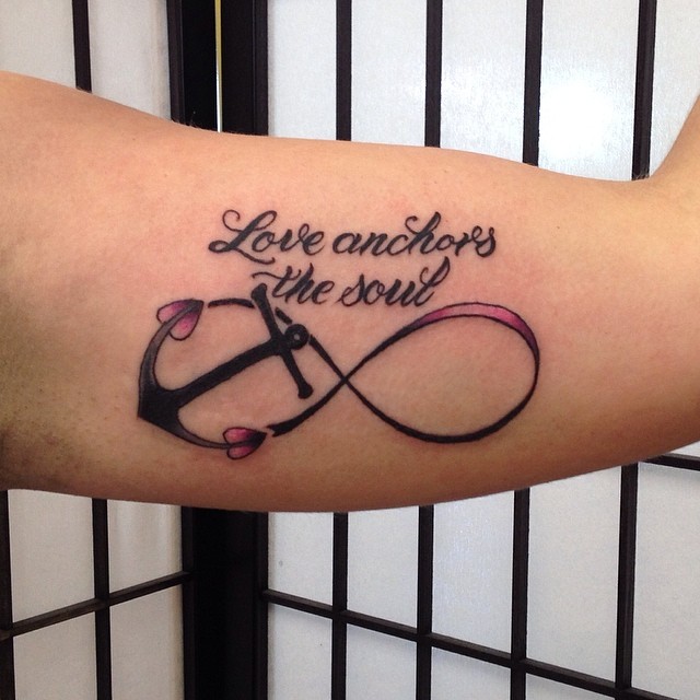 Pink And Black Infinity With Anchor Tattoo On Left Bicep