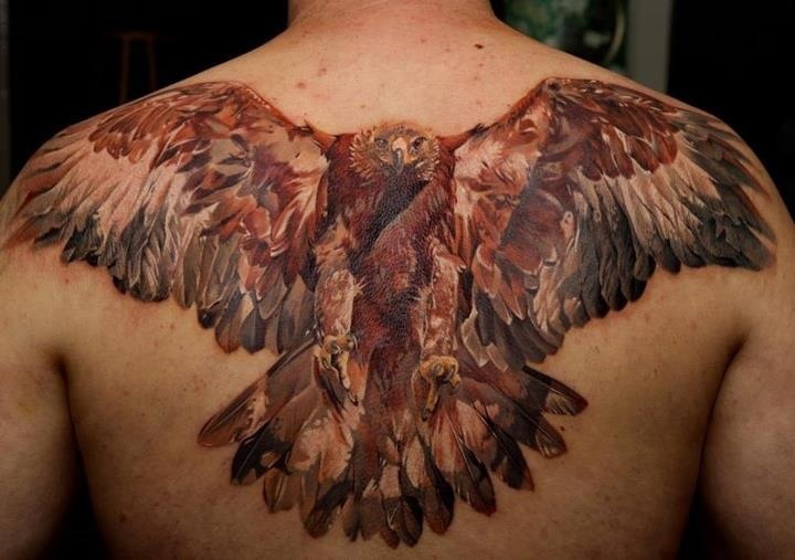 Realistic Flying Hawk Tattoo On Man Upper Back