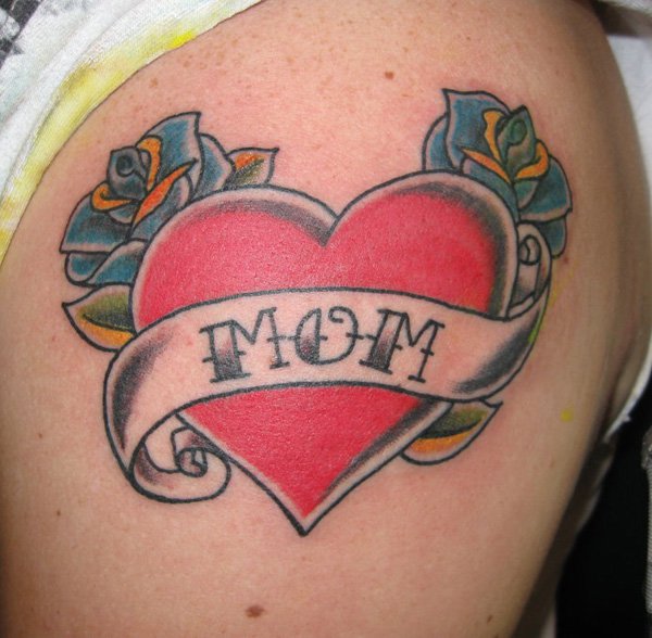 Red Heart With Roses And Banner Tattoo On Left Shoulder
