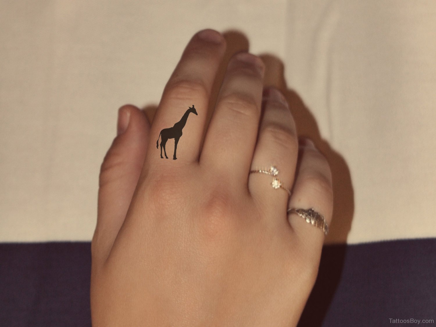 Silhouette Giraffe Tattoo On Girl Right Hand Finger