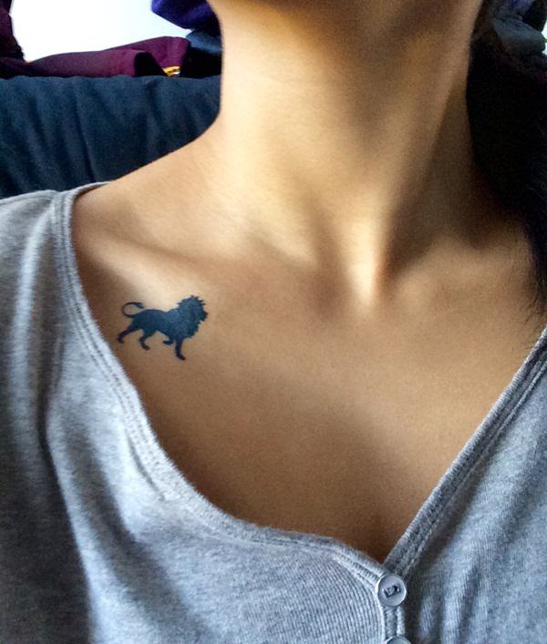 Silhouette Lion Tattoo On Girl Right Front Shoulder