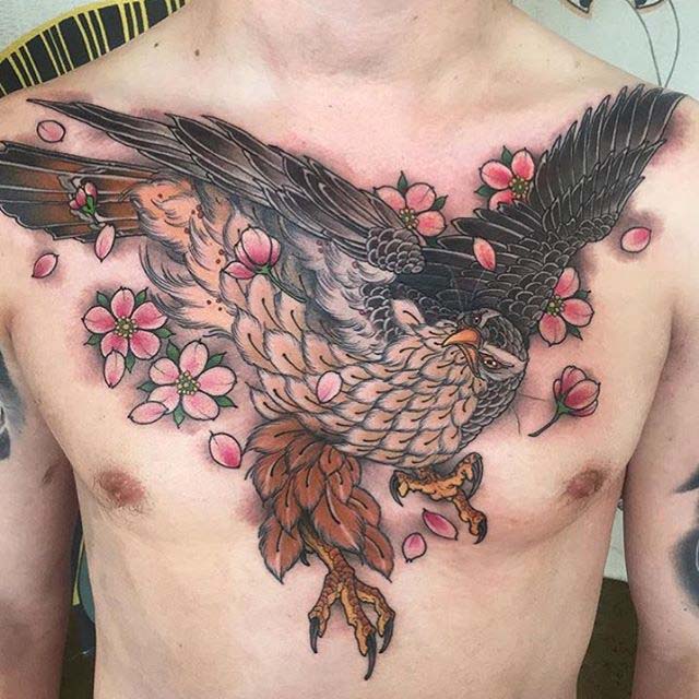 Traditional Flying Hawk Tattoo On Man Chest