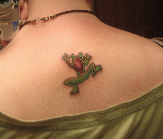 Traditional Frog Tattoo On Girl Upper Back
