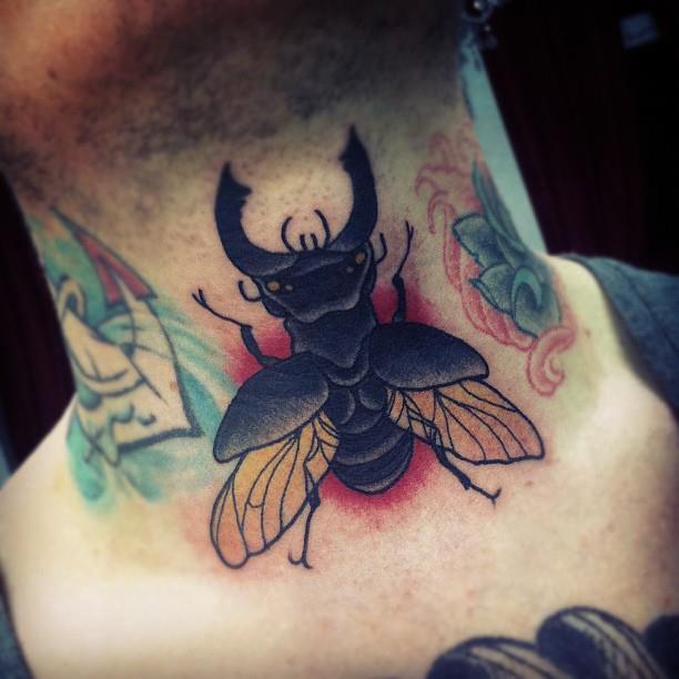 Traditional Insect Tattoo On Man Neck