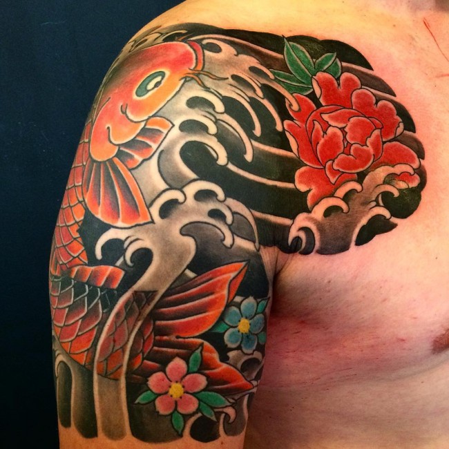 Traditional Japanese Koi Fish With Flowers Tattoo On Man Right Shoulder