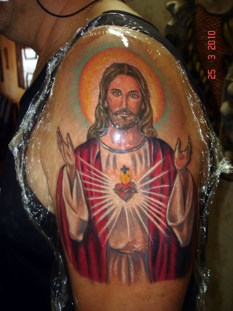 Traditional Jesus Head Tattoo On Man Left Shoulder