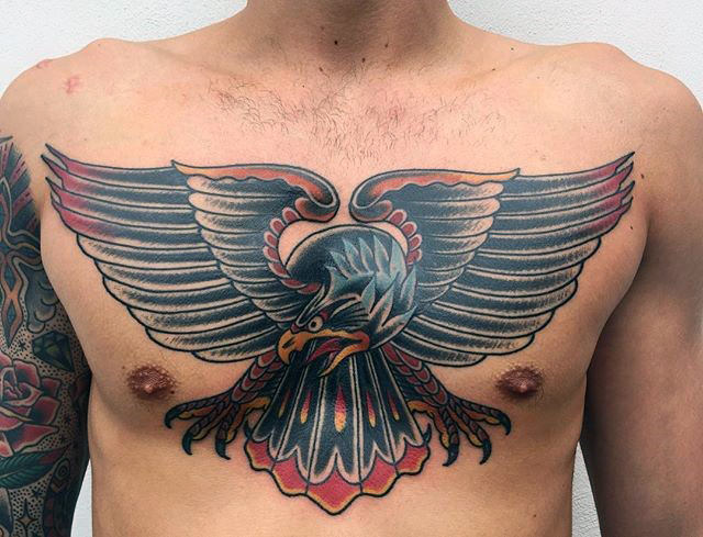 Amazing Black And Red Colored Eagle Tattoo On Chest