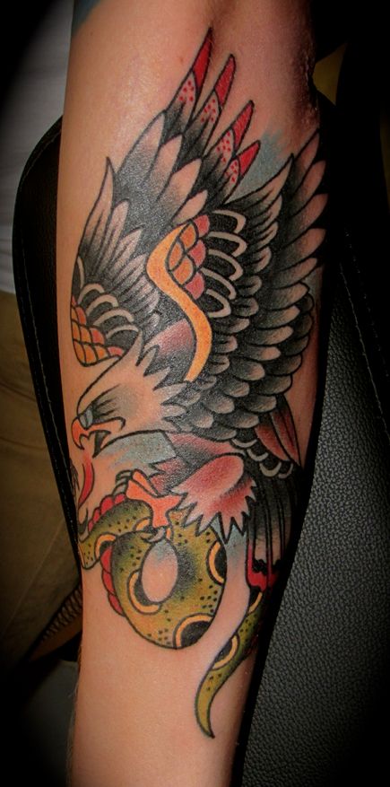 Amazing Snake And Eagle Fighting Tattoo On Forearm