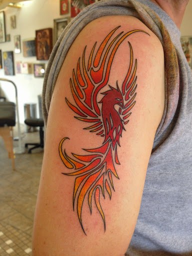 Amazing Tribal Phoenix Tattoo On Right Shoulder by acrosc