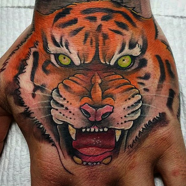 Angry Tiger With Green Eyes Tattooed On Left Hand