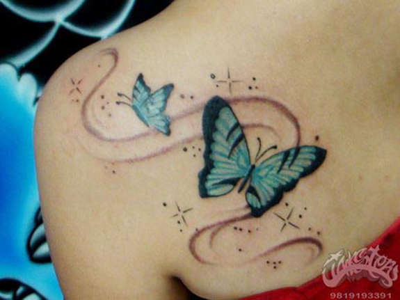 Black And Blue Swirl Butterfly Tattoo On Left Back Shoulder
