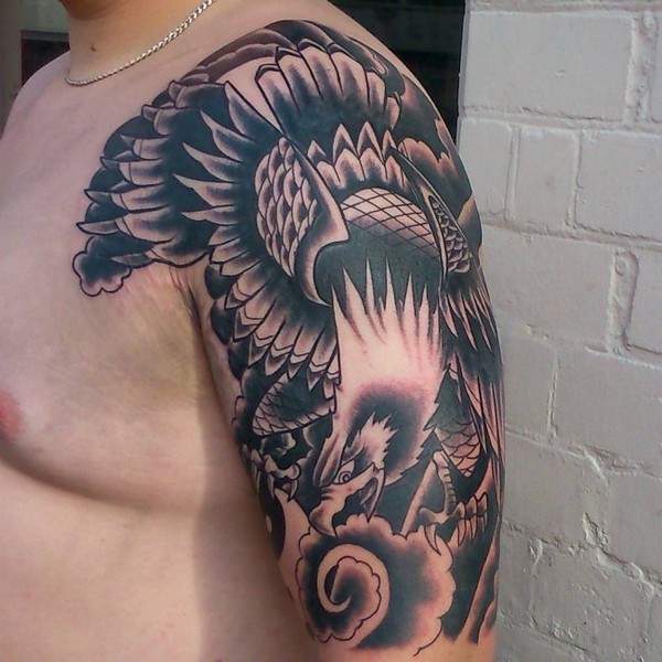 Black And Grey Flying Eagle Tattoo On Man Left Half Sleeve