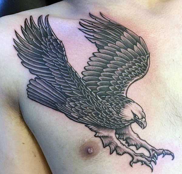 Black And Grey Landing Eagle Tattoo On Man Chest