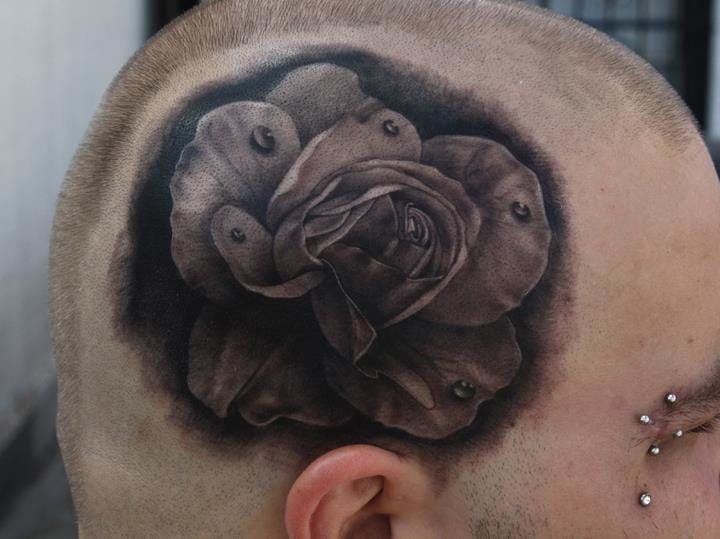Black And Grey Rose Flower Tattoo On Man Head